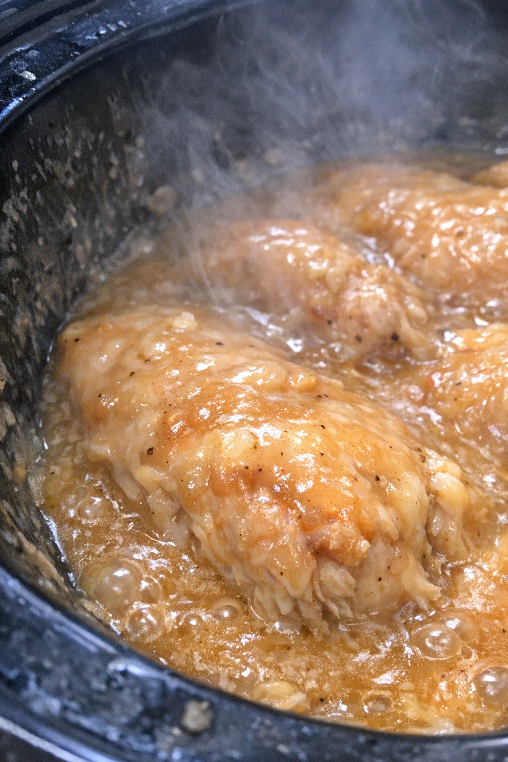 Finished slow cooker chicken in glossy sauce