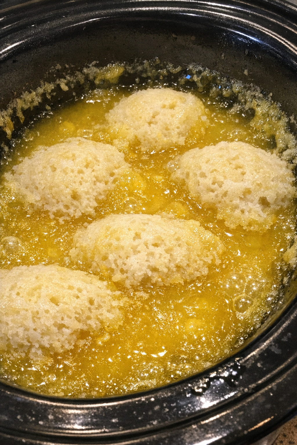 Vibrant yellow gelatinous dessert in a slow cooker