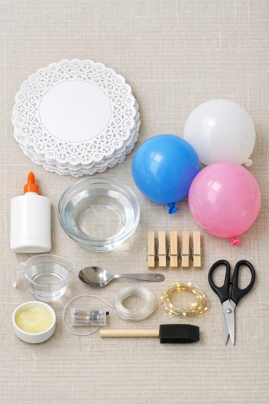 Materials for paper doily porch lanterns laid out together