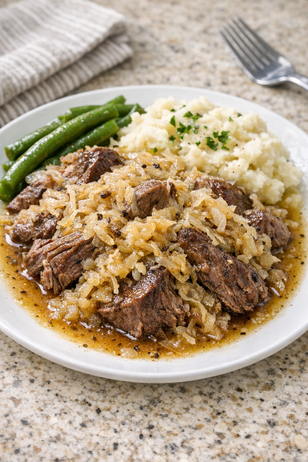Finished Amish sauerkraut beef plated with juices