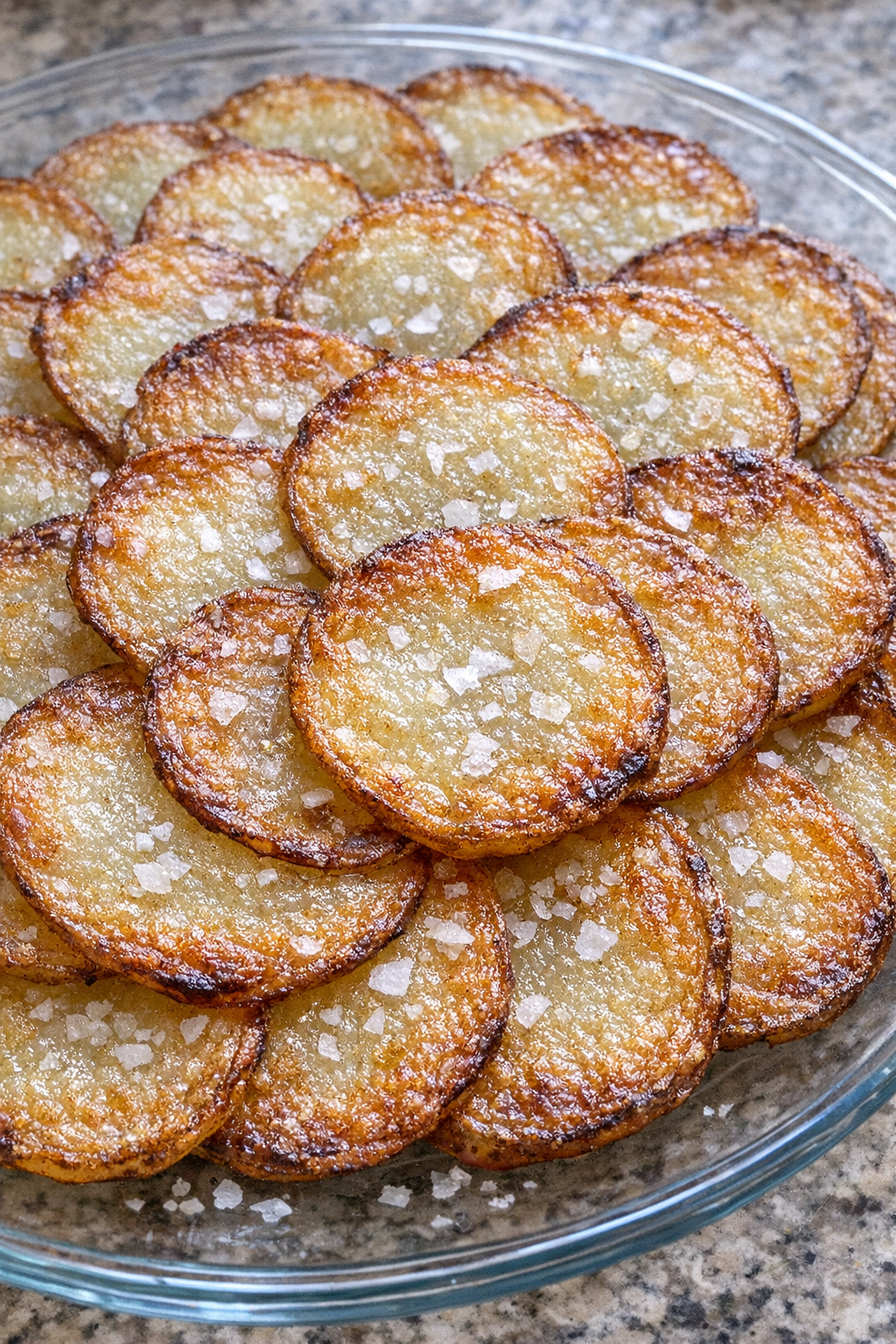 Crispy potato scallops on a glass plate
