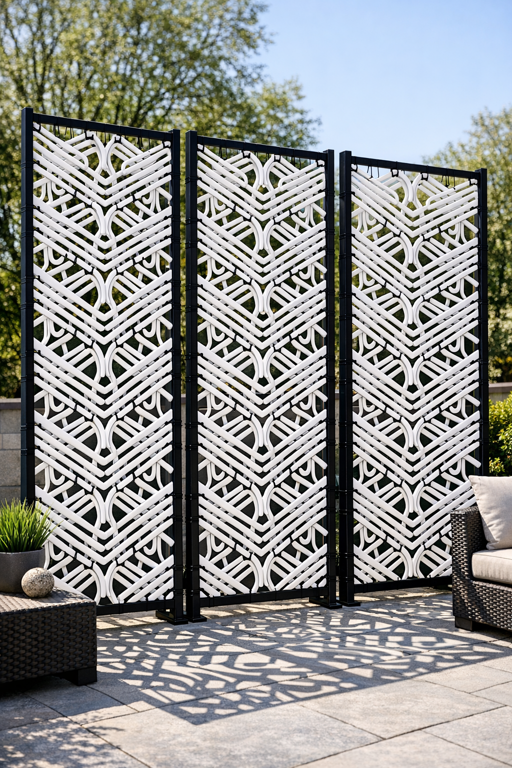 Finished modern patio privacy screens made from white hangers on black trellises