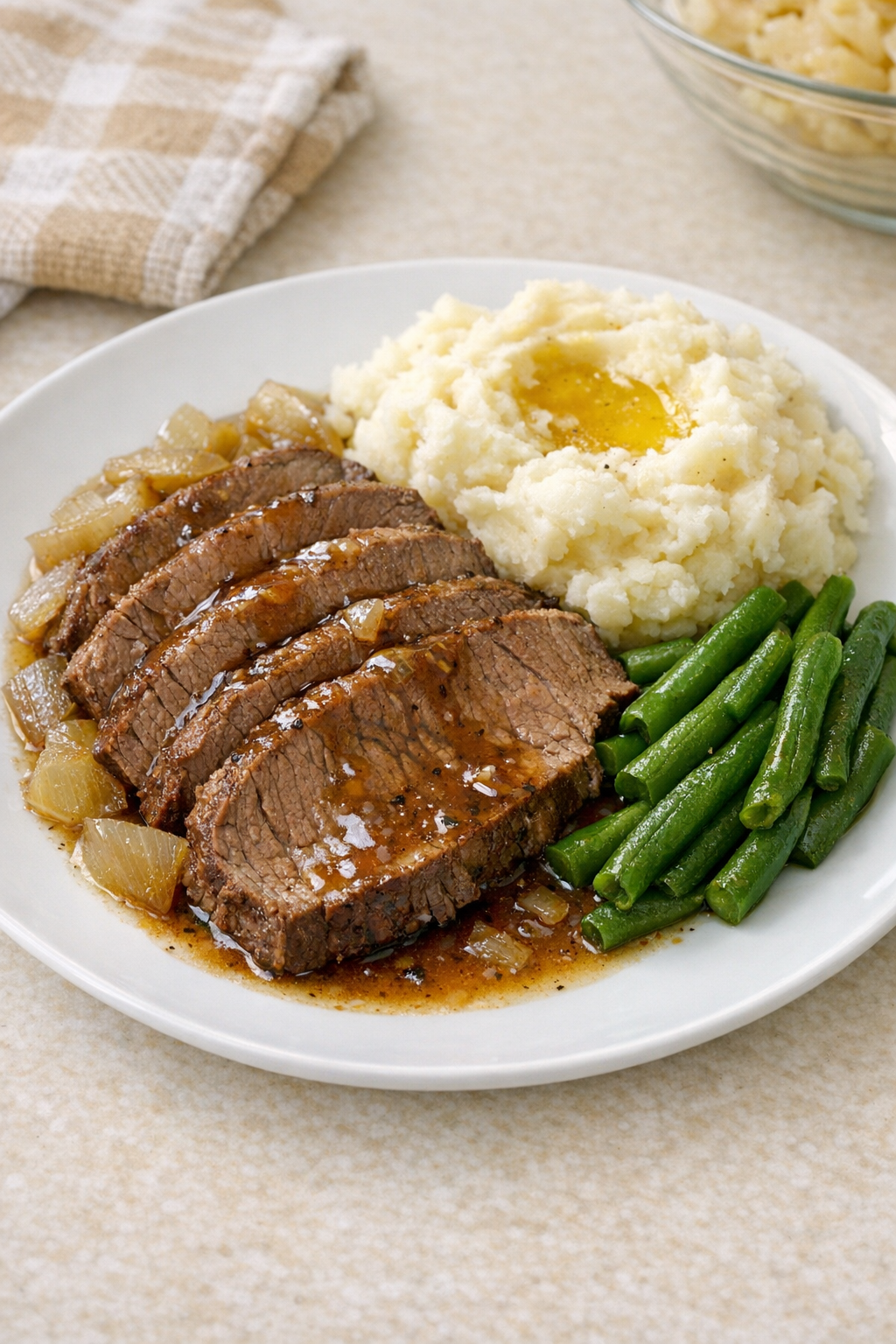Finished Amish bay leaf beef plated with pan juices