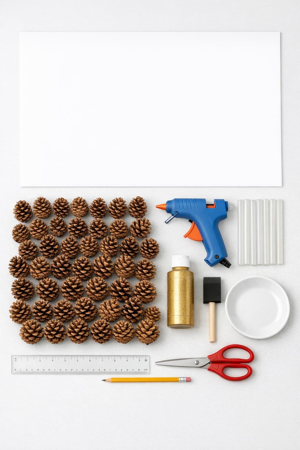 Materials laid out for a pinecone cone holiday craft