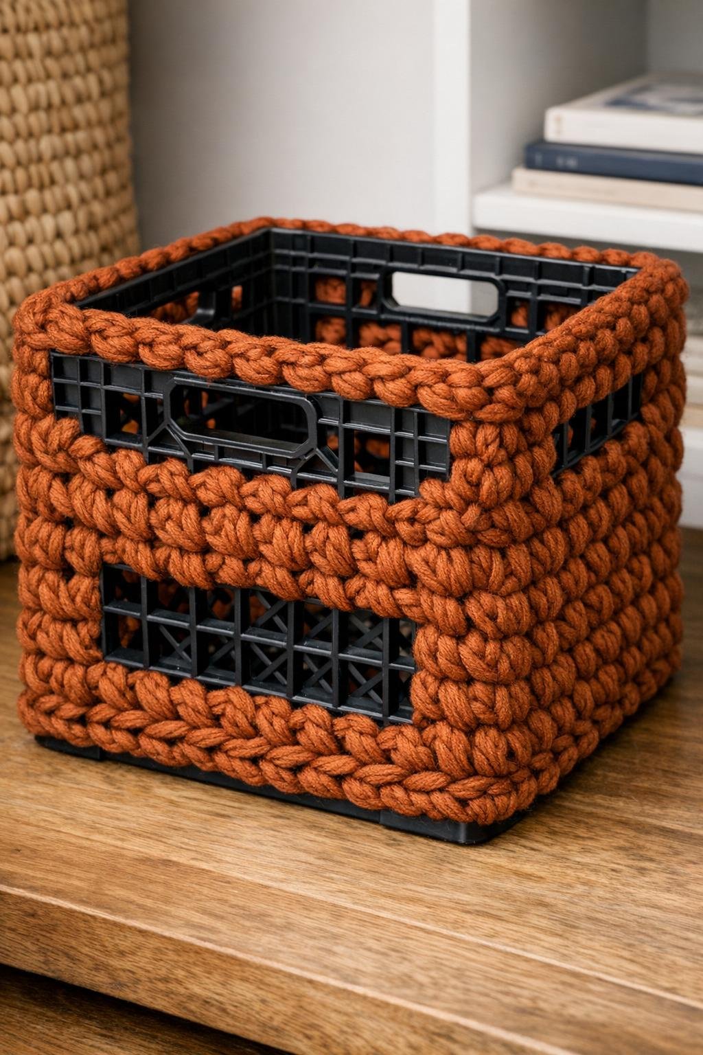 Finished crochet-covered milk crate basket in chunky rust yarn