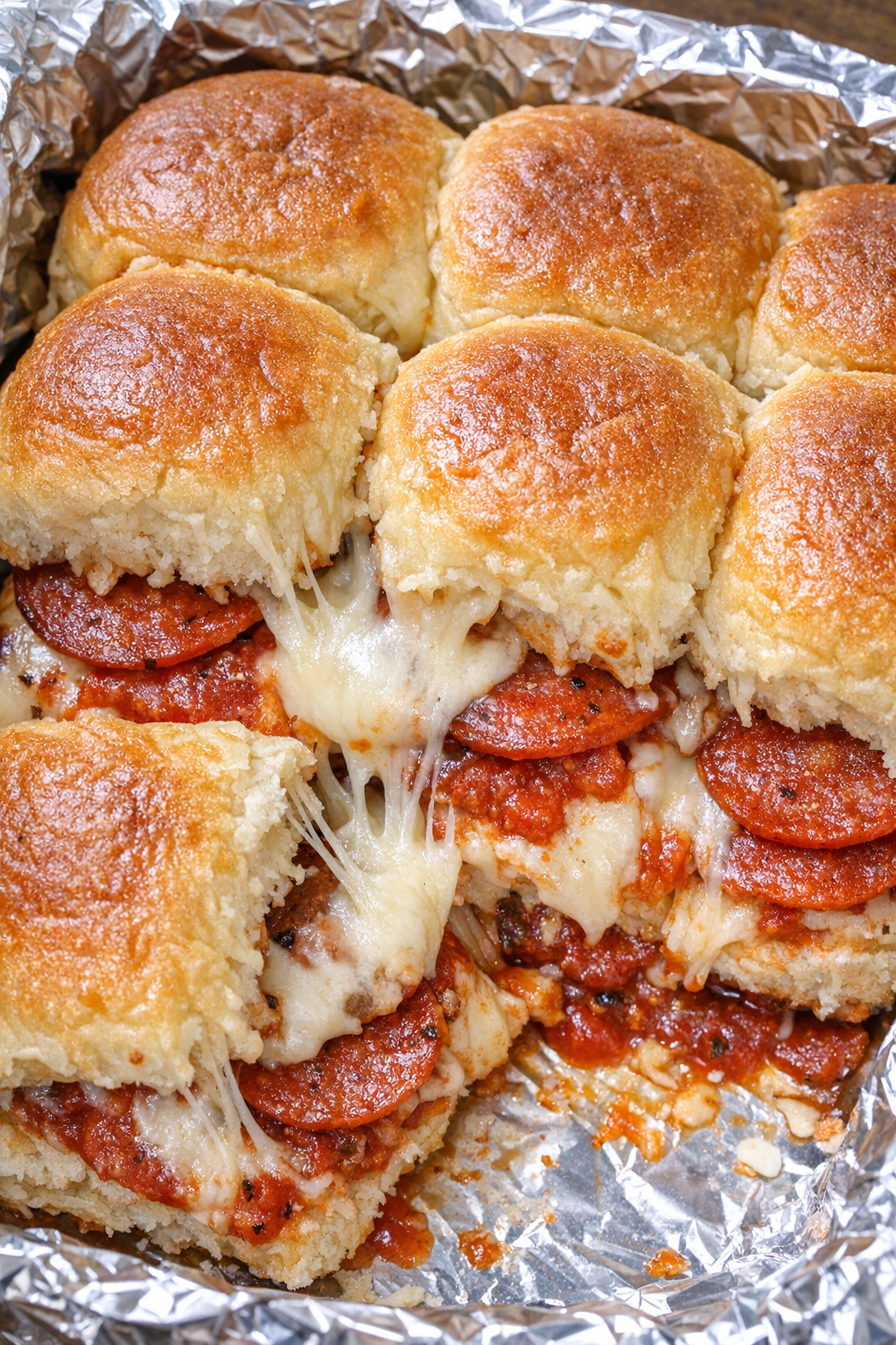 4-ingredient pizza sliders in a foil-lined platter