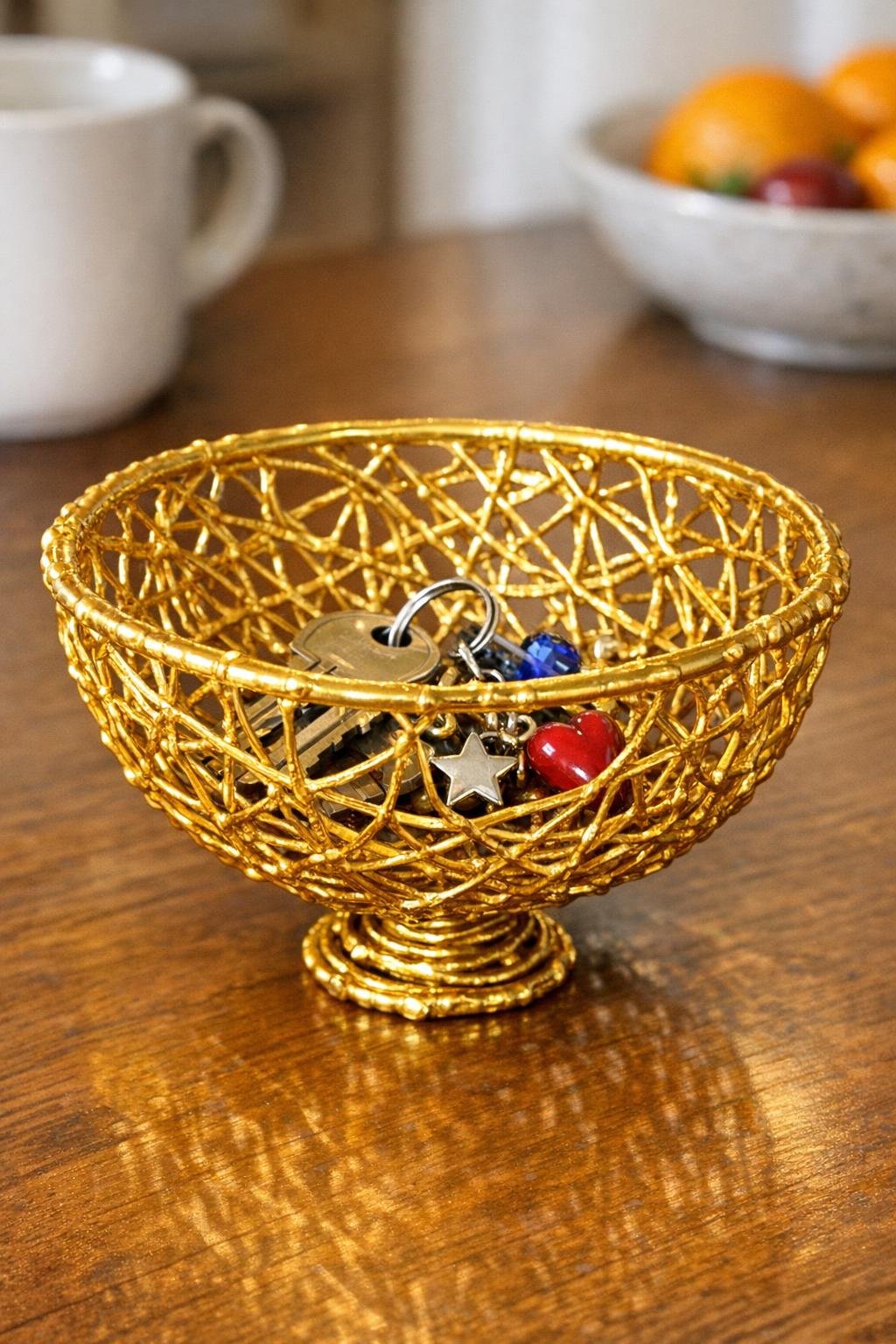 Finished metallic gold basket bowl made from hot glue