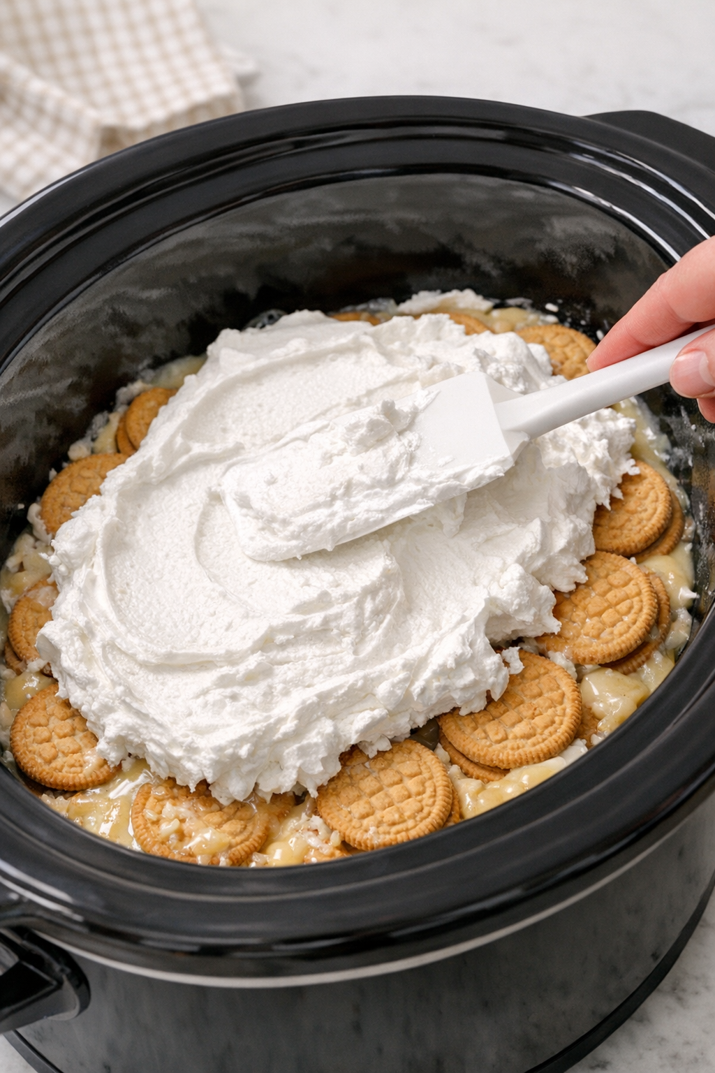 Whipped topping spread over the dessert