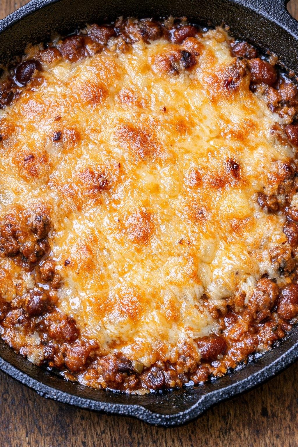Southern 3-ingredient chili cheese dip in a cast iron skillet
