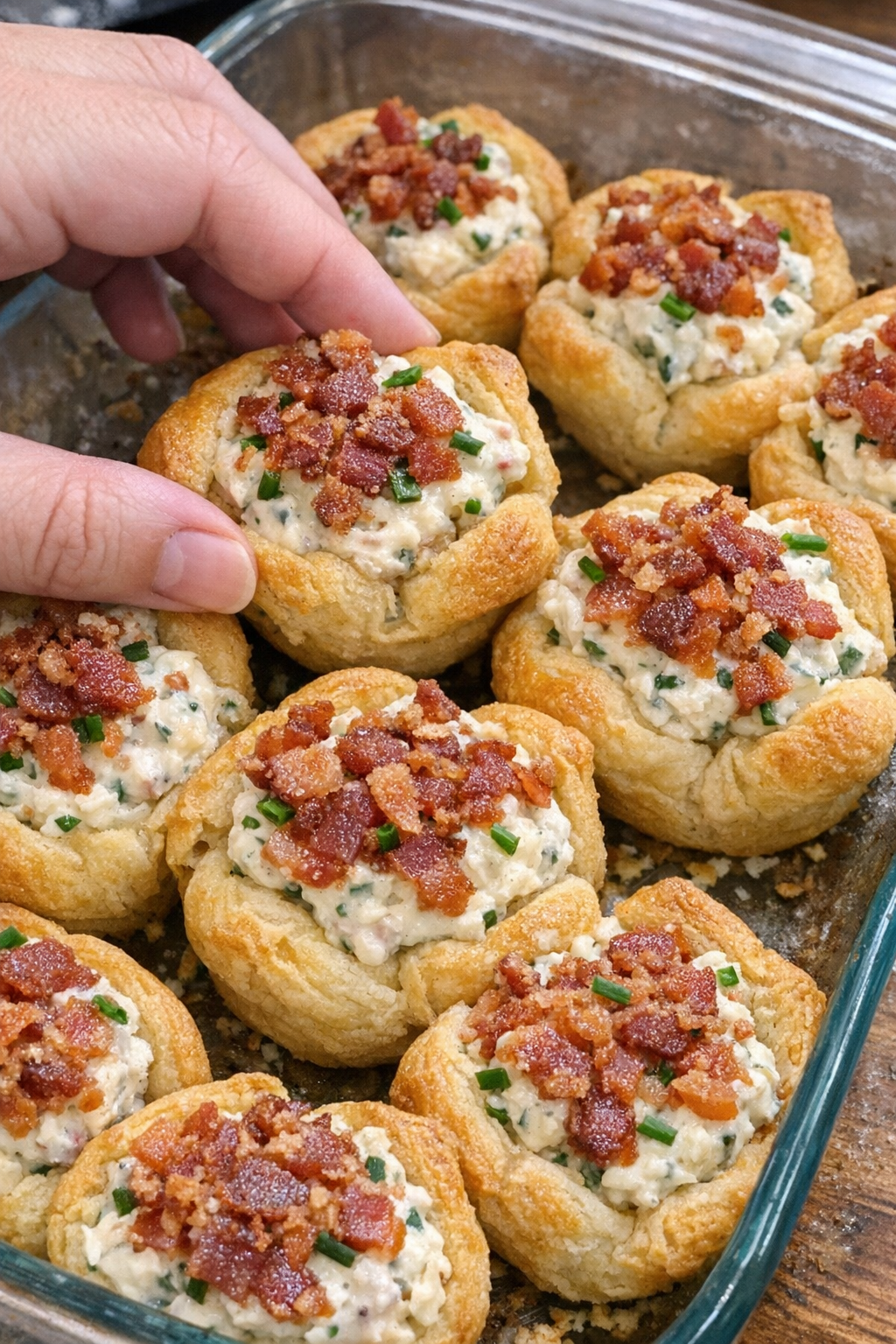 Oven baked bacon ranch crescent cups in a glass baking dish