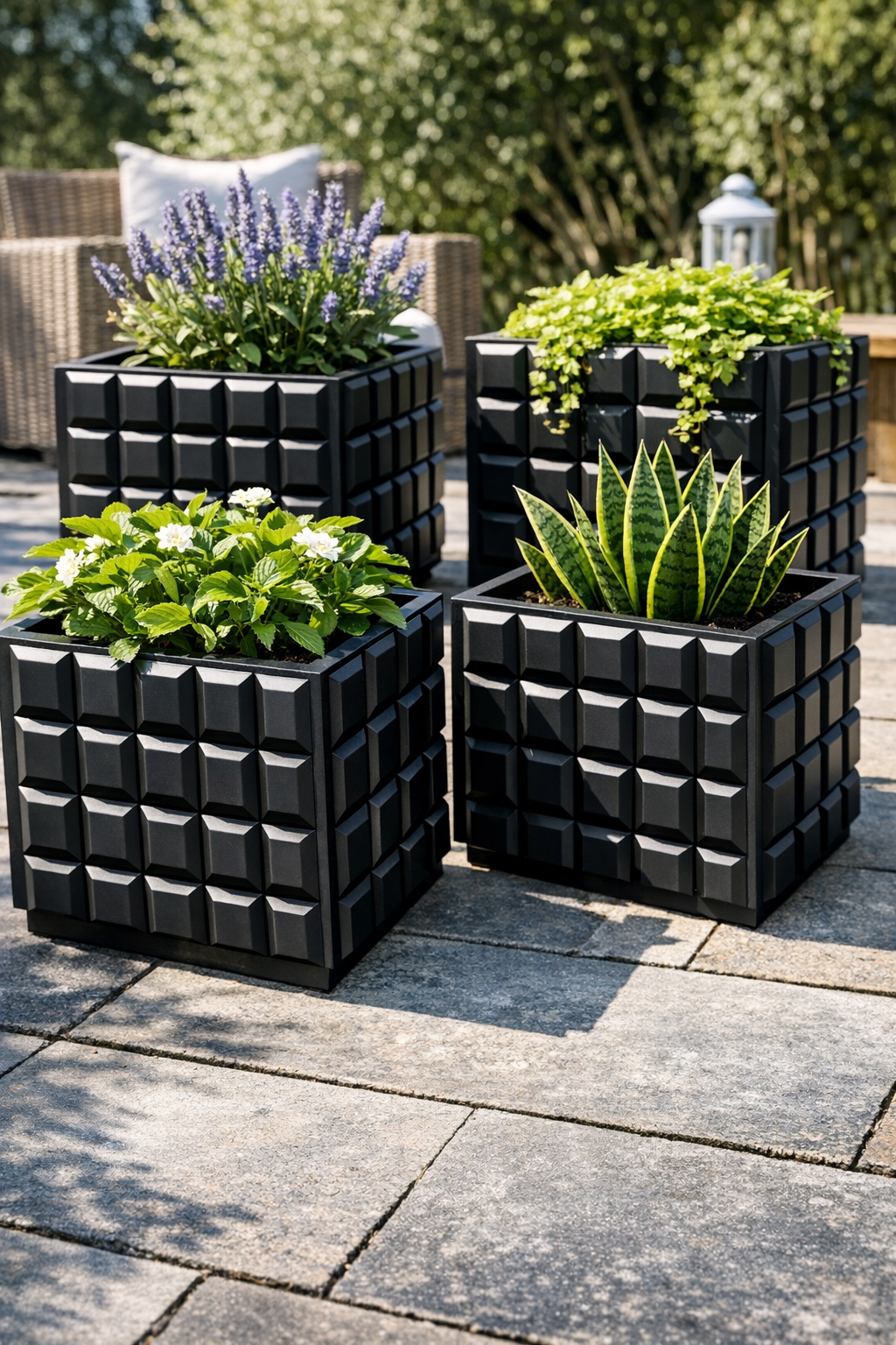 Finished matte black geometric patio planters with greenery
