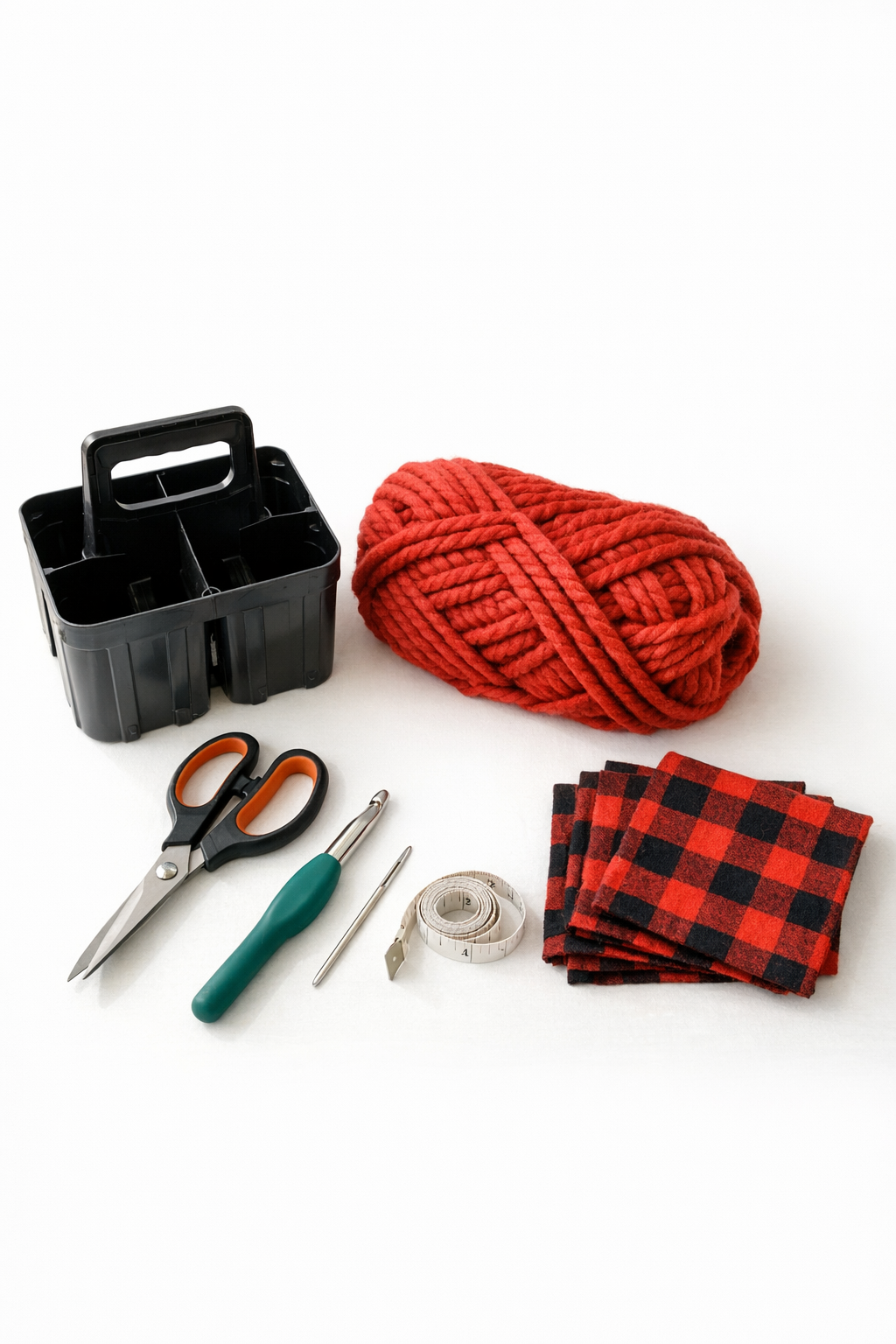 Materials for a crochet s'mores caddy laid out on a table