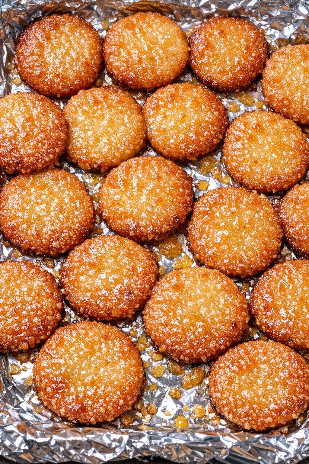 Southern 3-ingredient crispy buttermilk pennies on a foil-lined baking tray