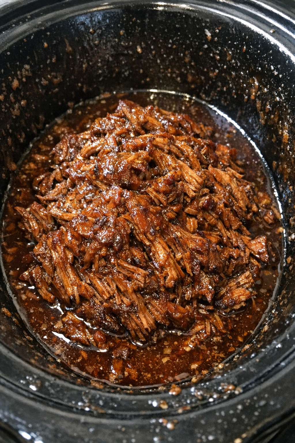 Slow cooker glazed shredded beef in a slow cooker