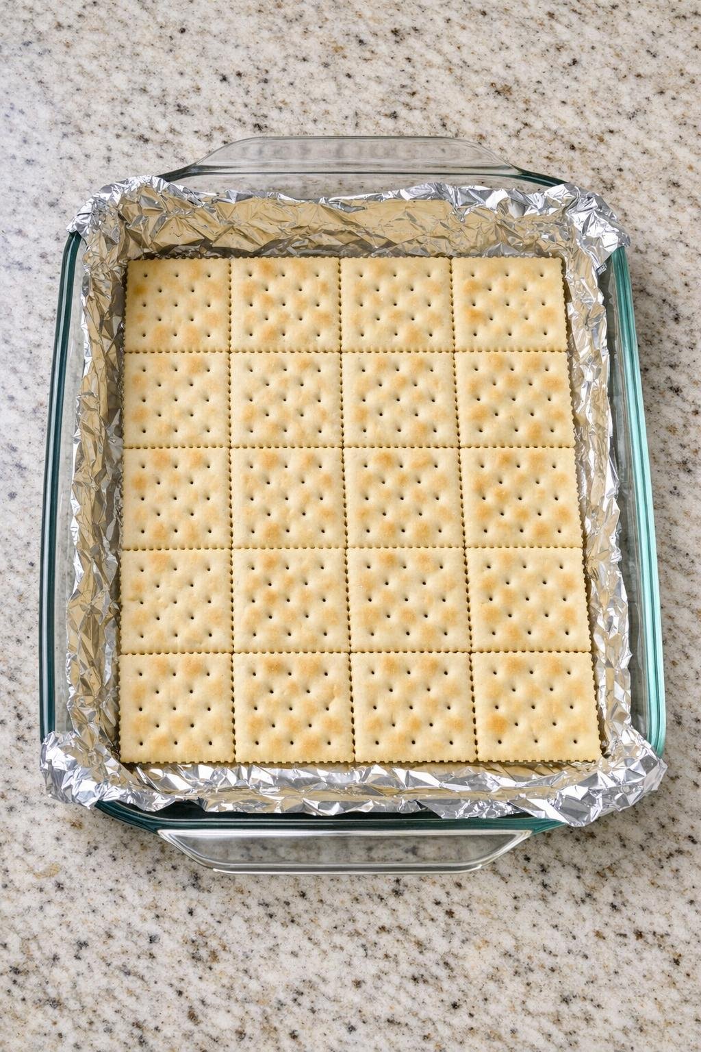 Soda crackers arranged in a baking dish