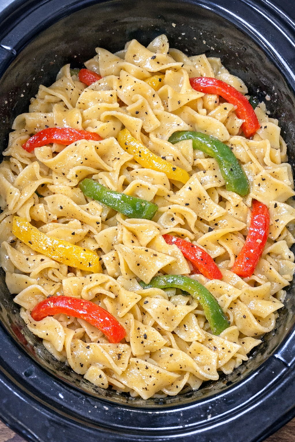 Finished Amish bell pepper noodles in a black slow cooker