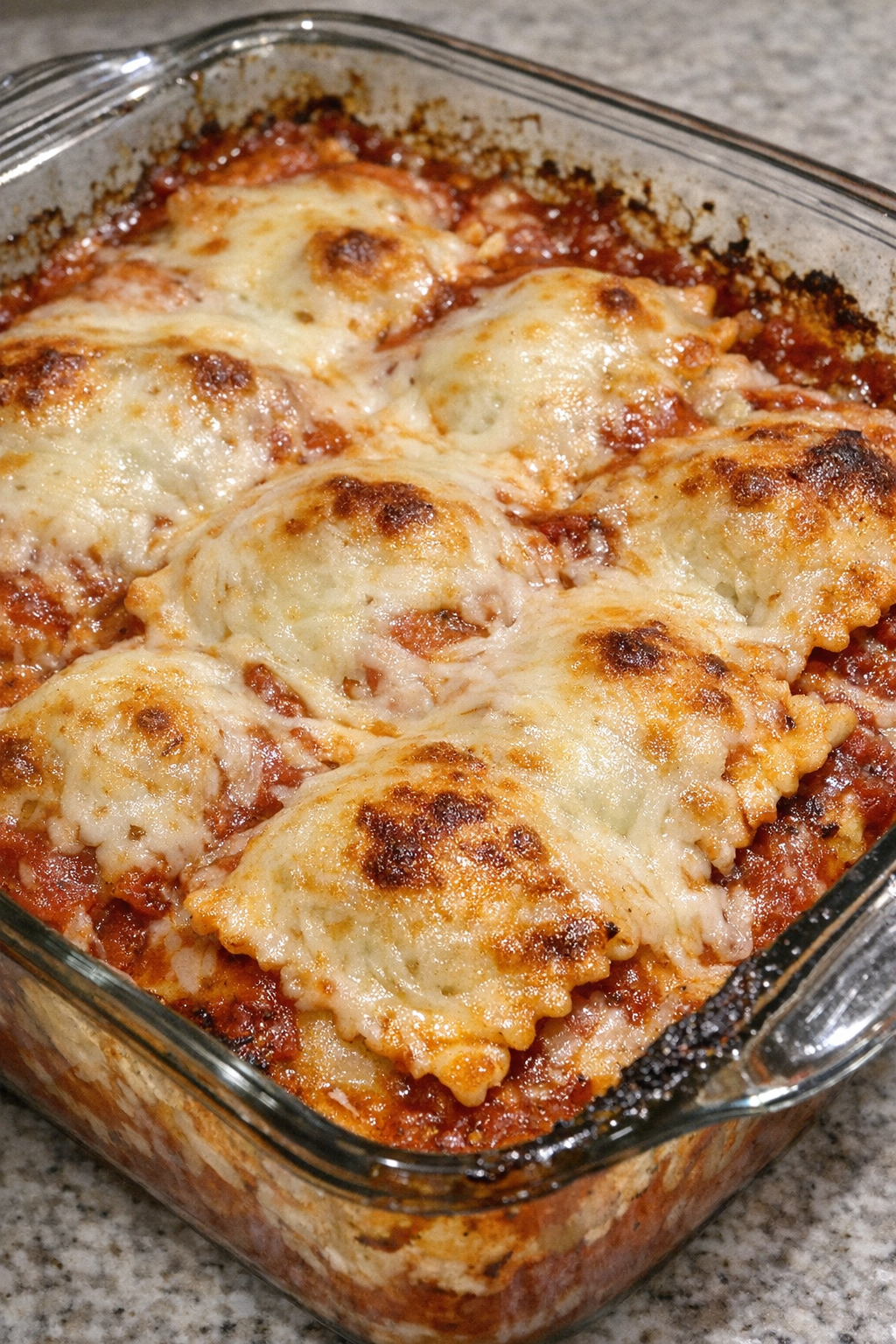 Baked ravioli lasagna in a glass dish
