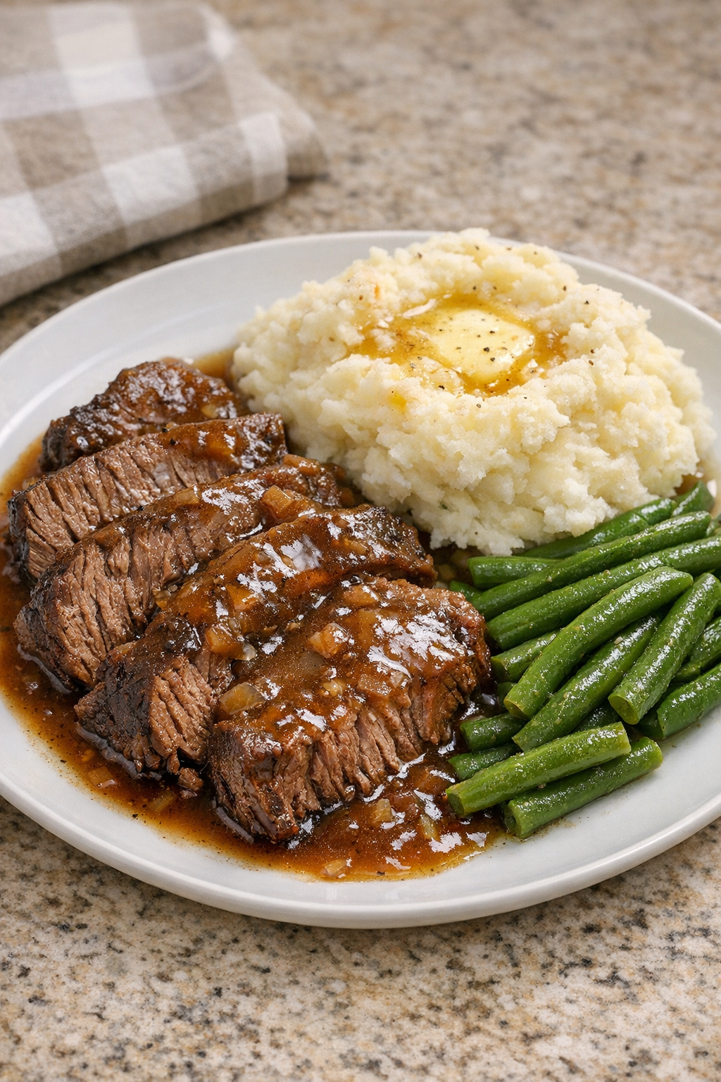Finished Amish bay leaf beef pot roast plated with gravy