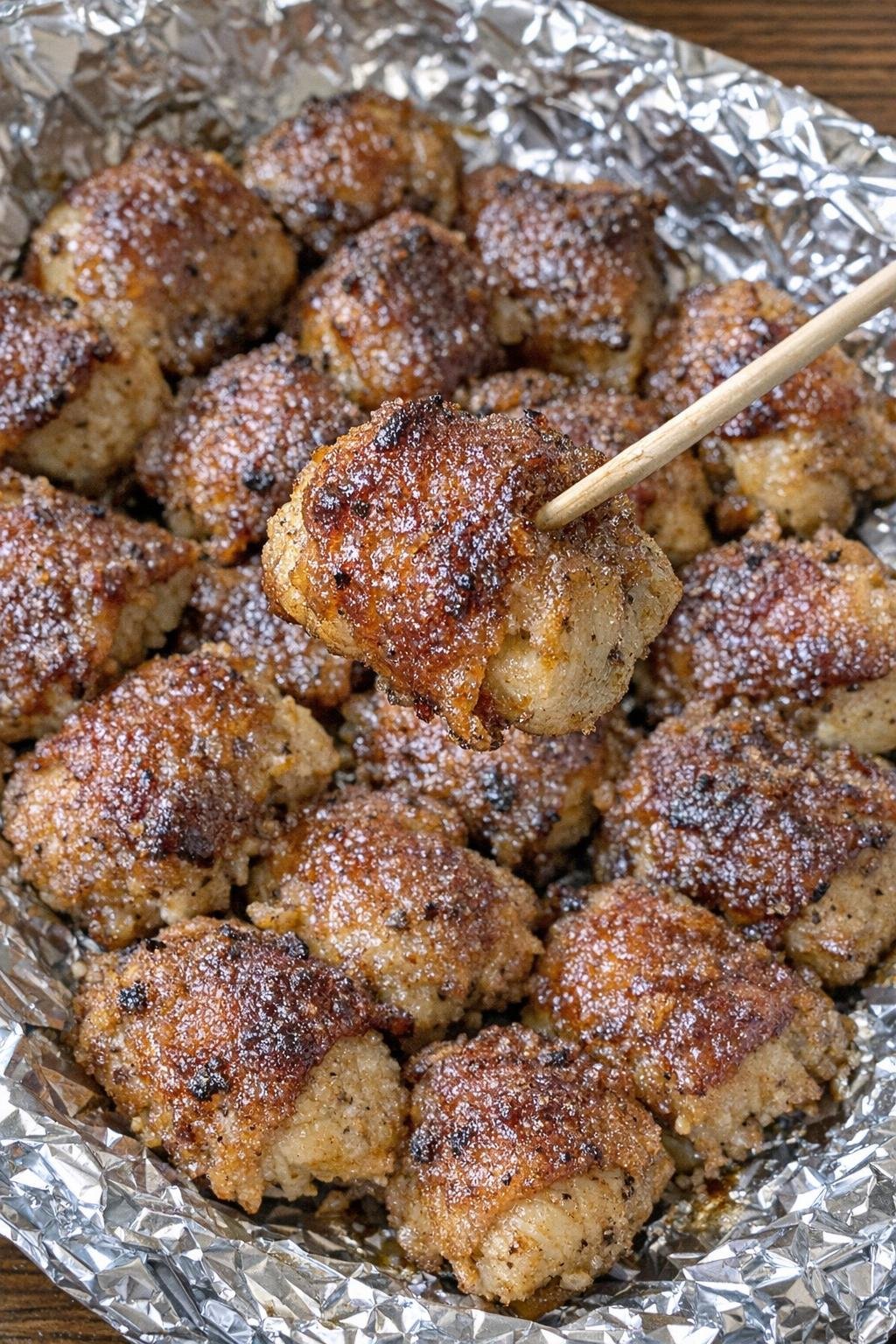 Close up of chicken Carmichael bites on a foil-lined platter