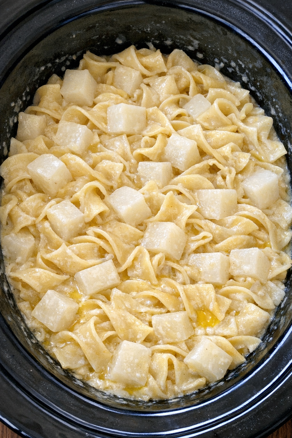 Slow cooker Amish turnip noodle pot in a black slow cooker