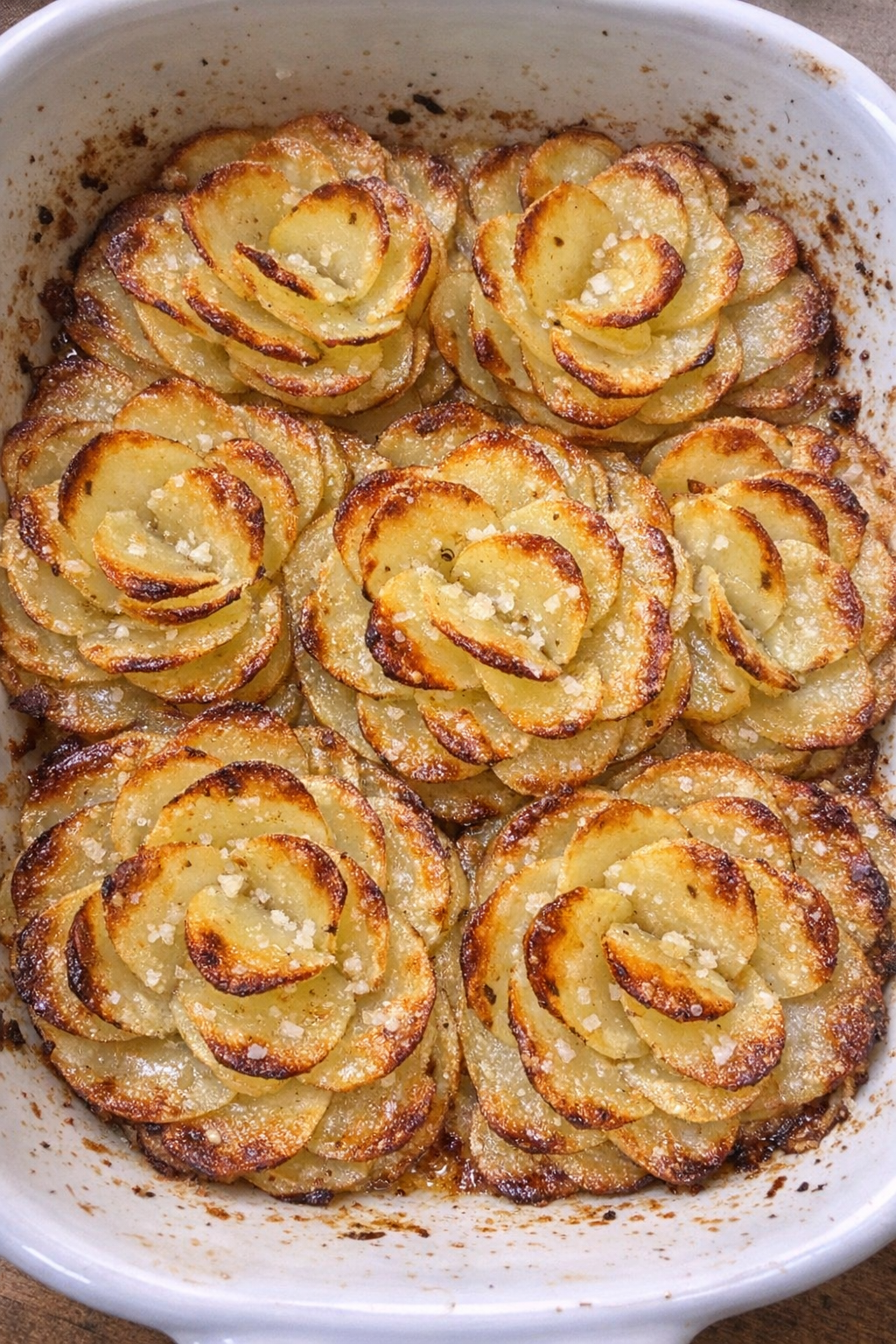 Baked potato petals in a white casserole dish