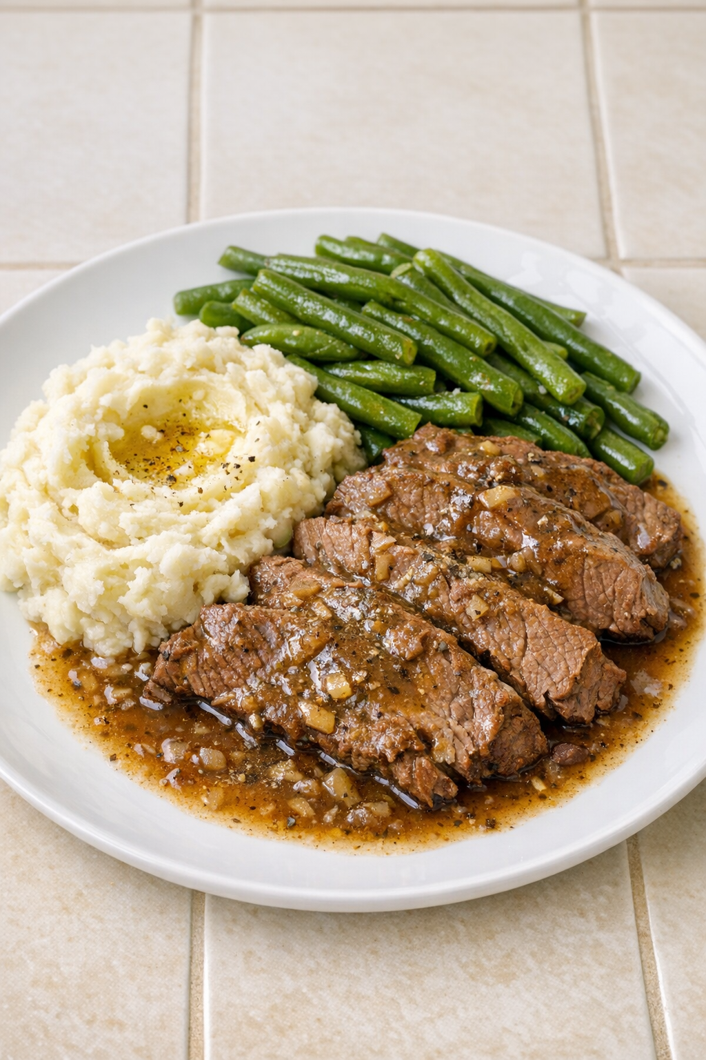 Finished Amish sage beef plated with mashed potatoes