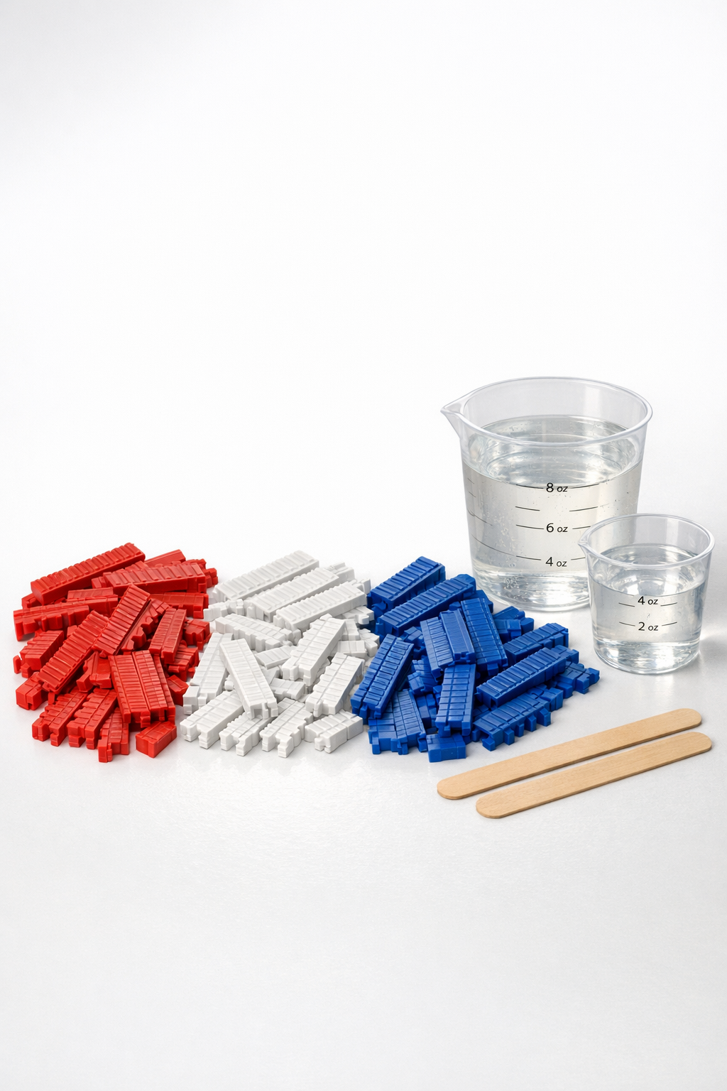 Snapped red, white, and blue plastic rulers and clear bonding compound laid out neatly