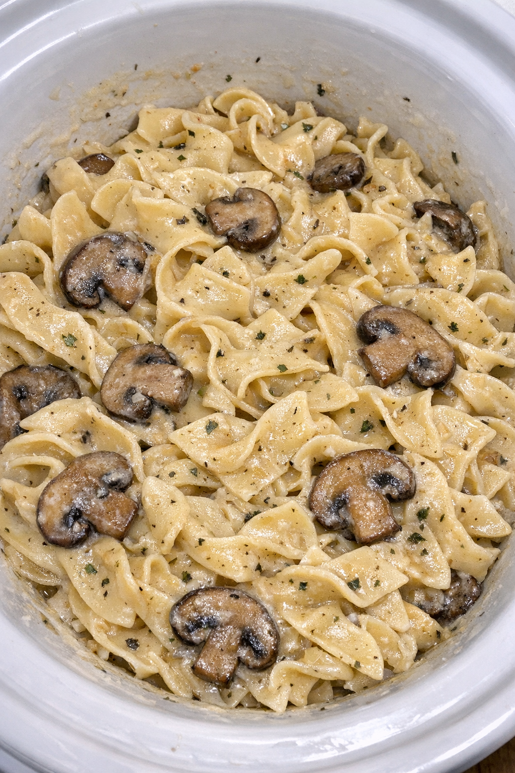 Slow cooker Amish mushroom noodles in a white slow cooker