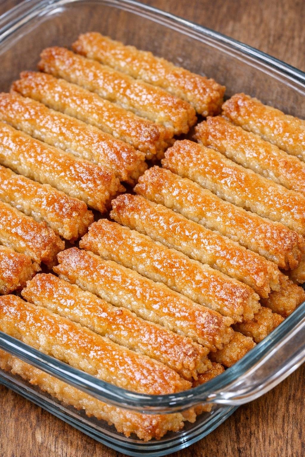 Southern 3-ingredient buttery cheese straws in a glass casserole dish