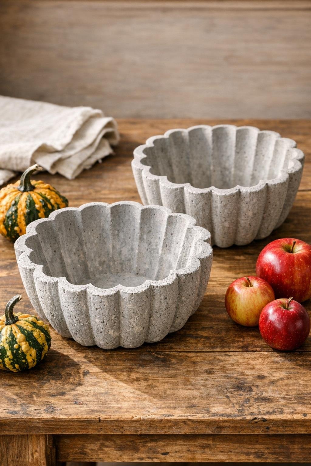 Finished pair of fluted concrete harvest bowls on a table