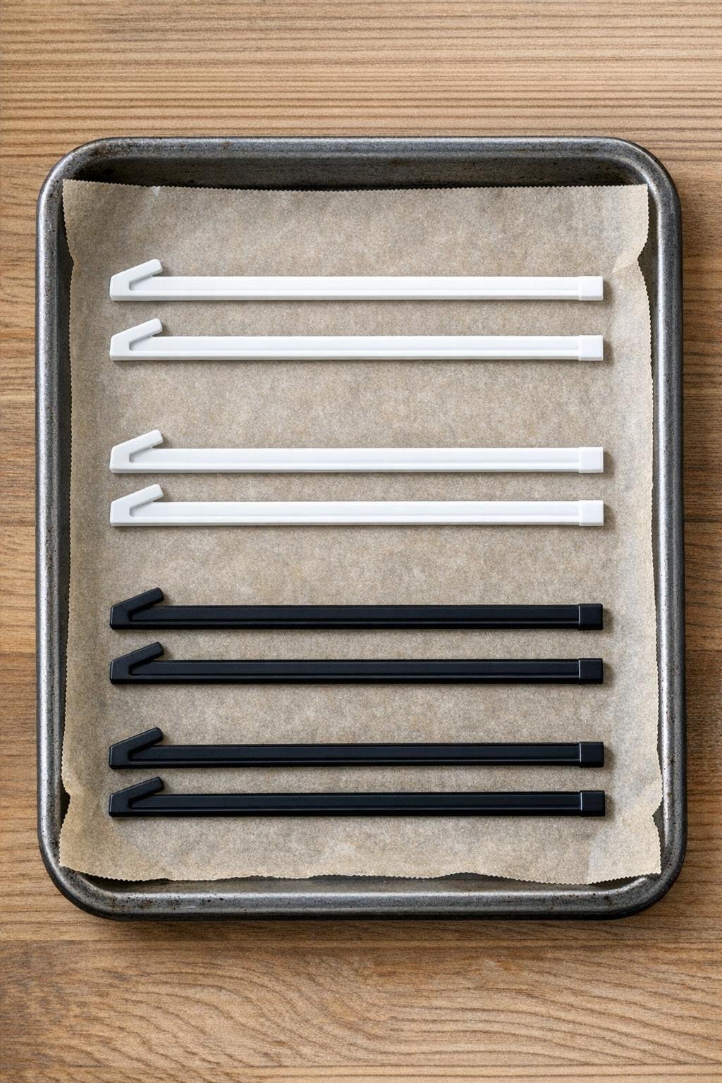 Straight hanger pieces arranged on parchment before heating
