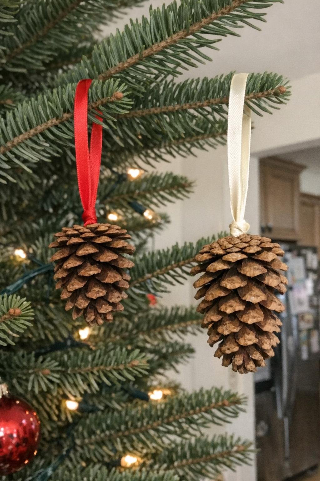 Pine cone Christmas ornaments hanging on a tree