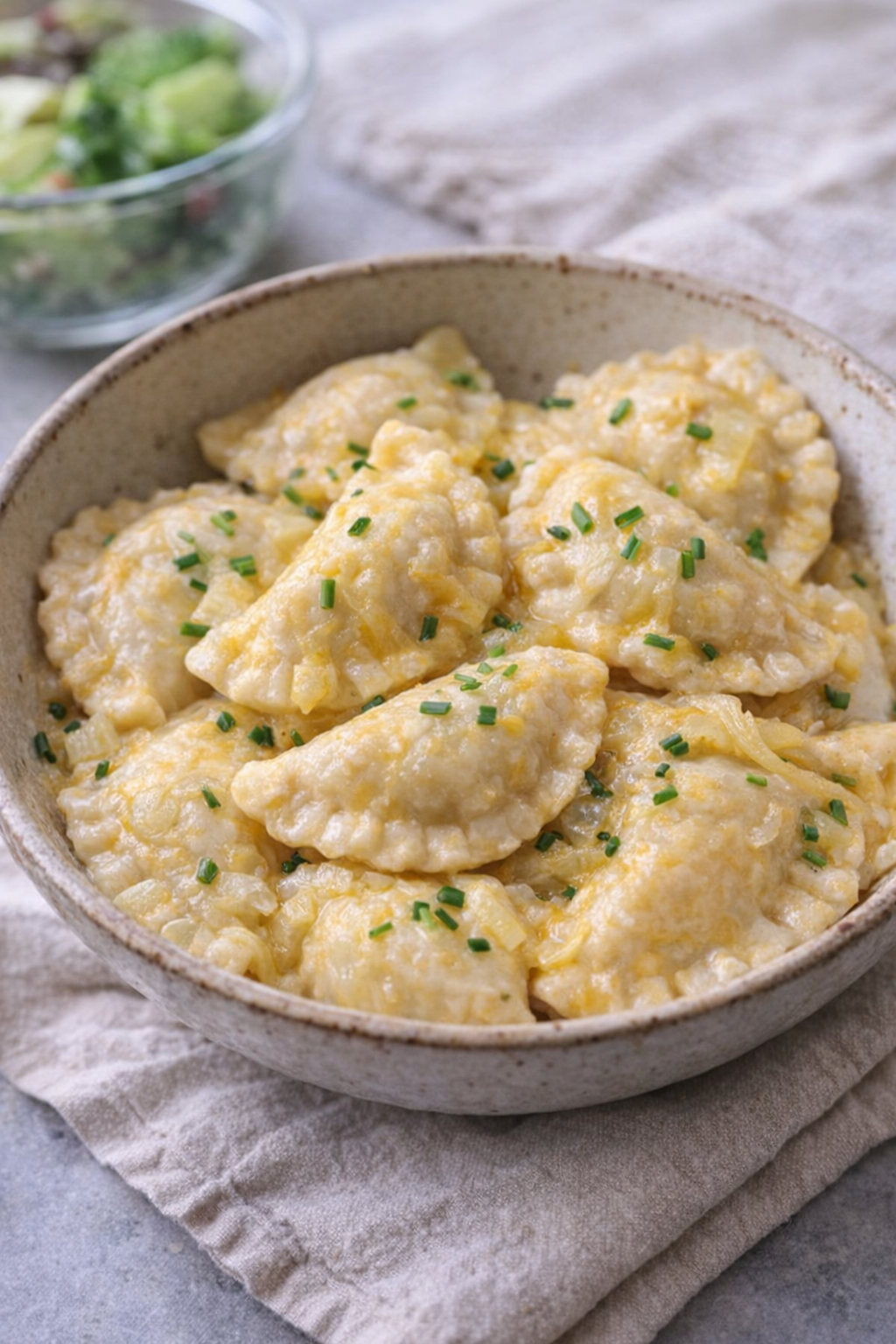 Slow cooker pierogi served in a cozy family-style bowl