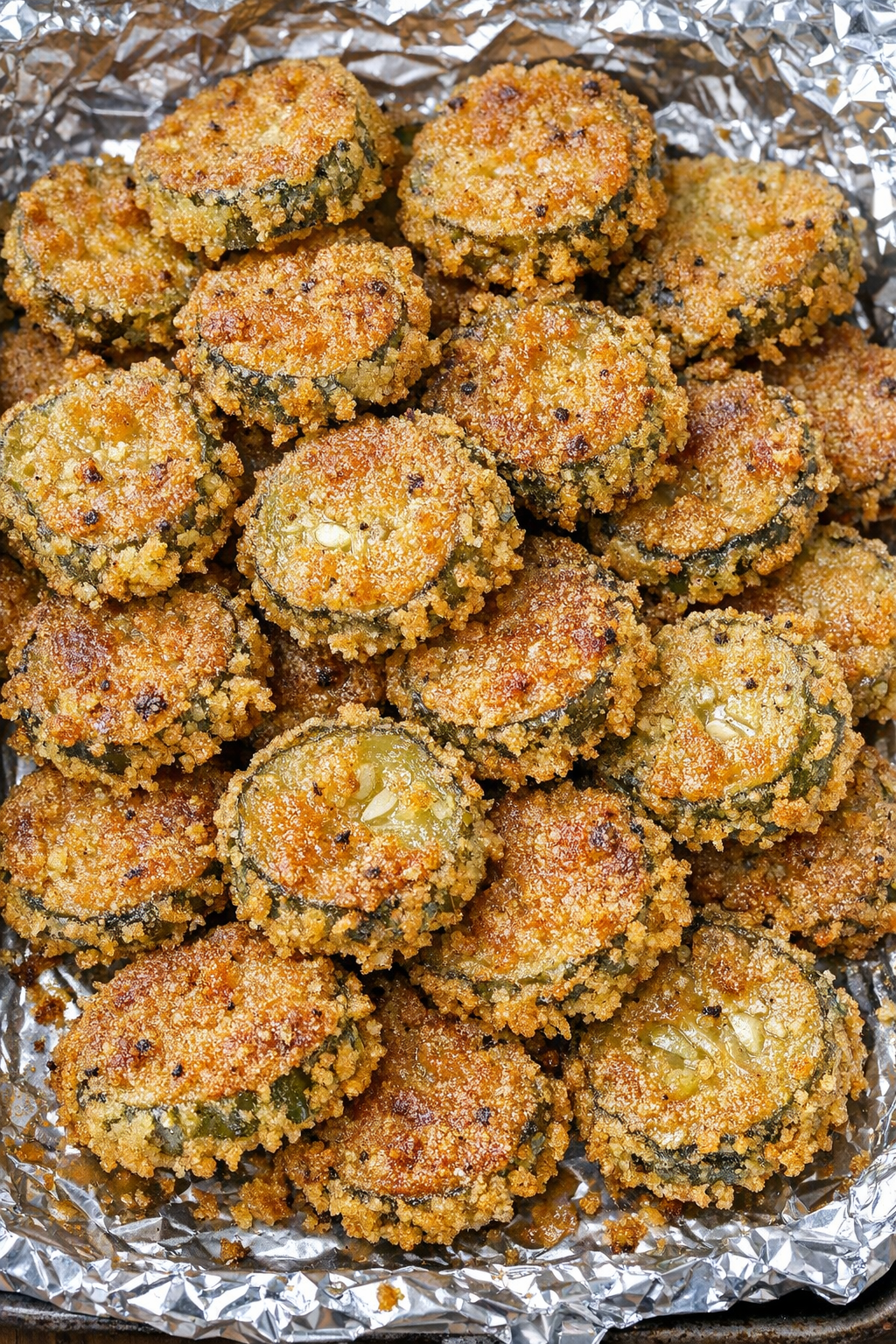 Southern 4-ingredient crispy fried pickles on a foil-lined baking tray