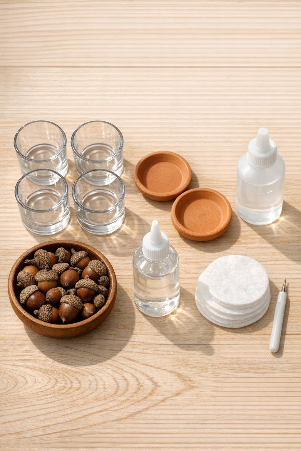 Materials for a two-piece autumn centerpiece display laid out on a table