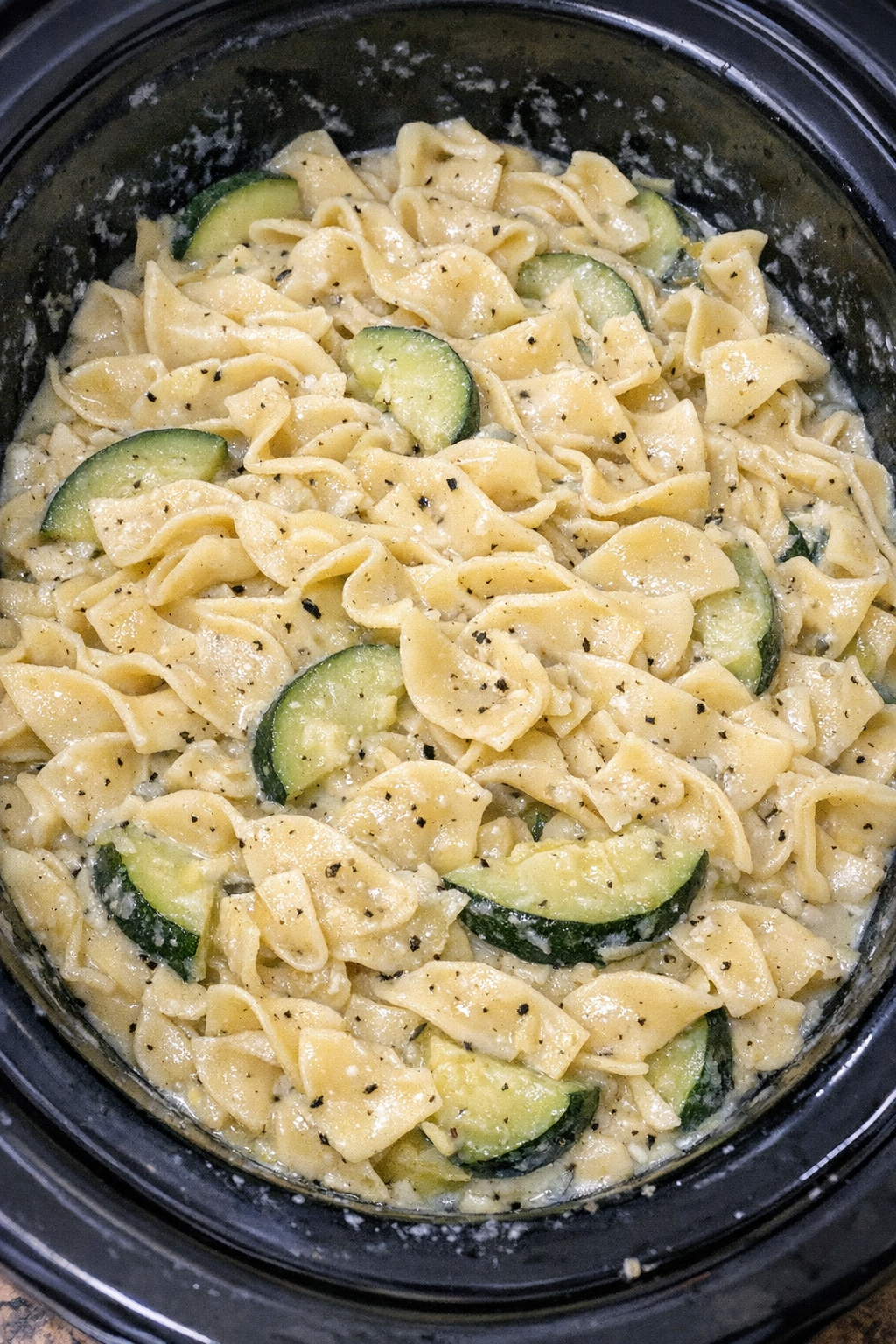 Slow cooker Amish zucchini noodles in a black slow cooker