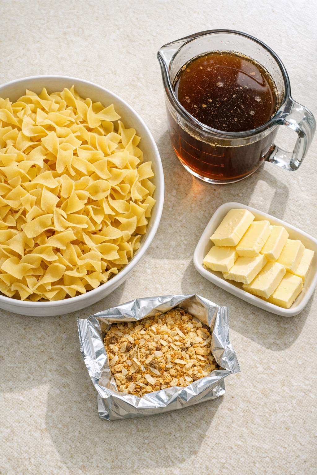 Measured ingredients for onion soup mix noodles