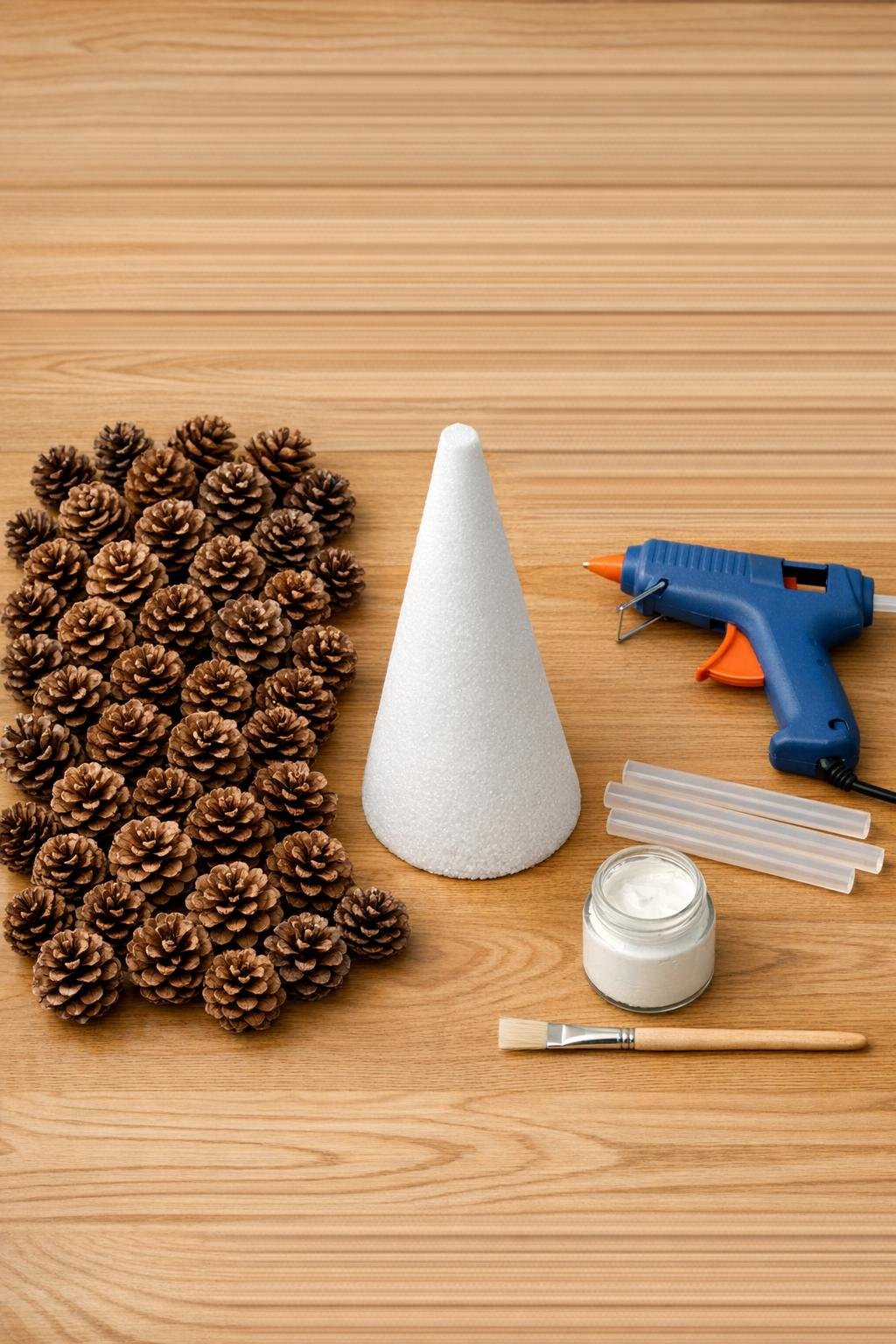 Materials for making a pinecone tabletop tree laid out together