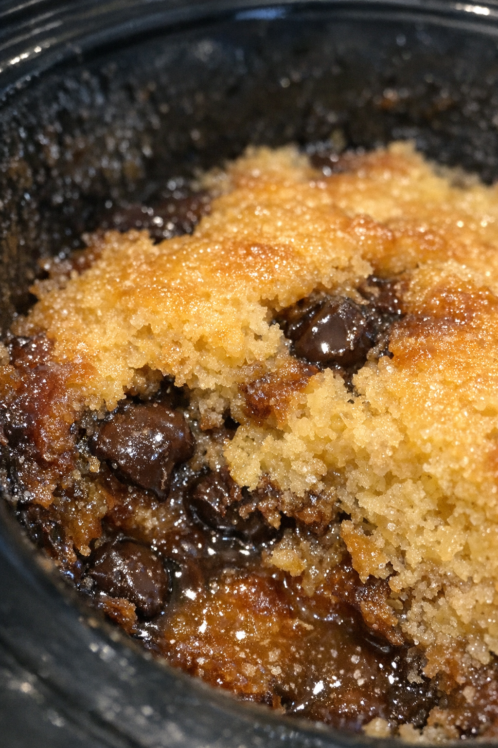 Warm golden pudding cake in a slow cooker