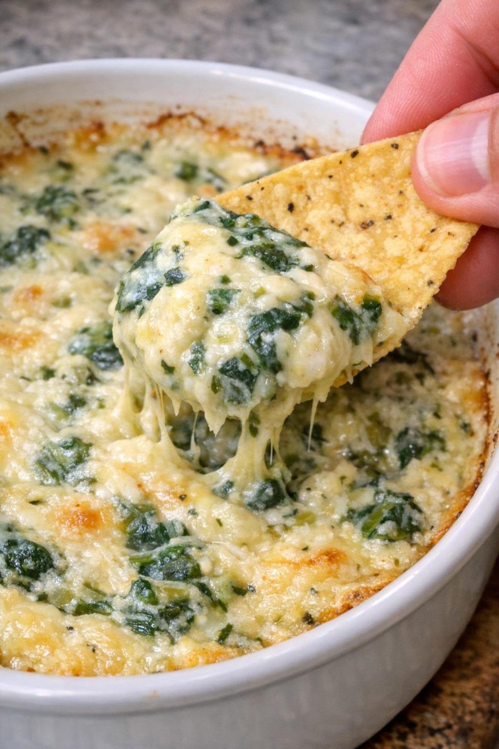 4-ingredient spinach bingham dip in a round casserole dish