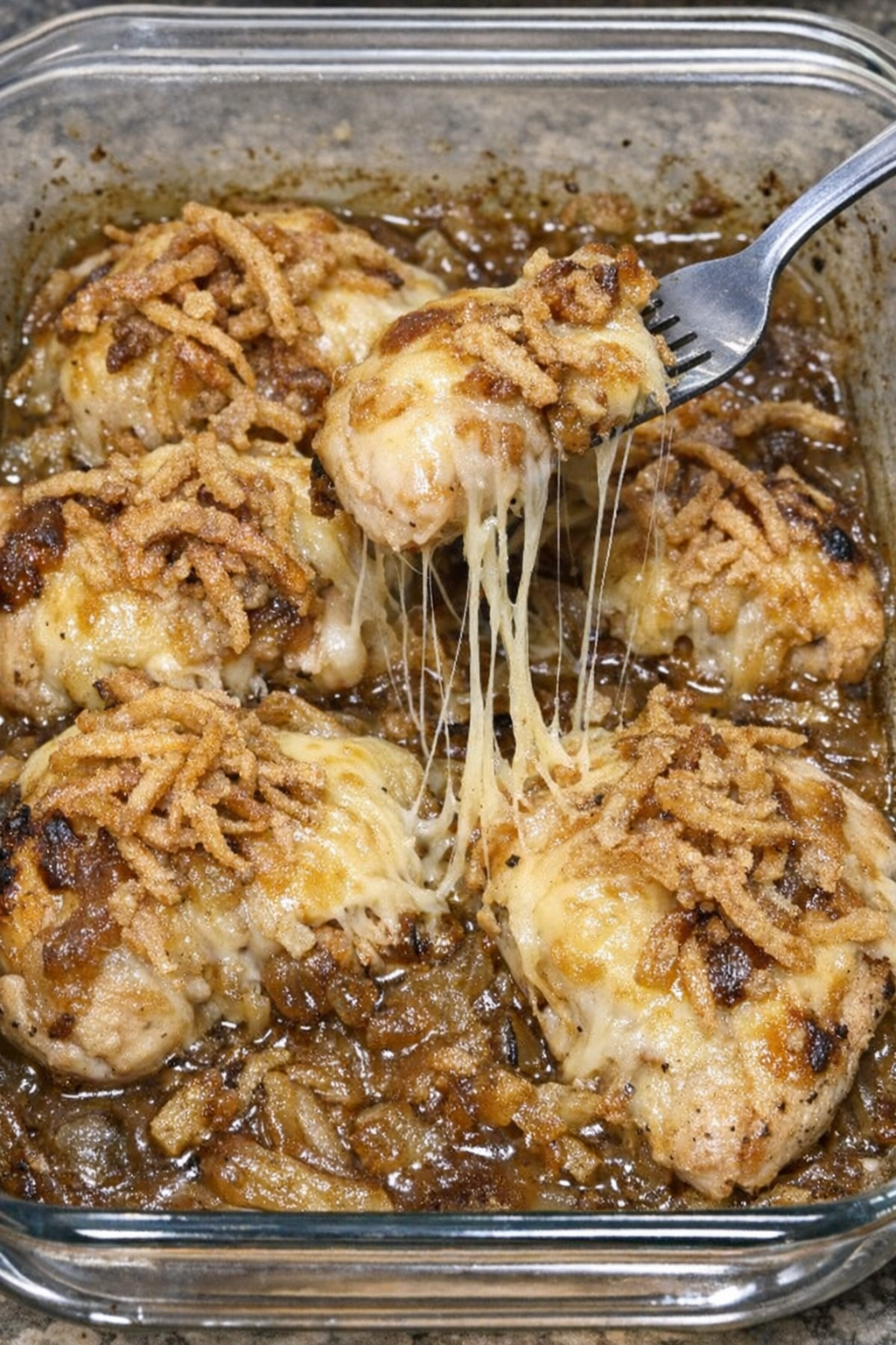 Finished chicken French onion bake with stretchy melted cheese