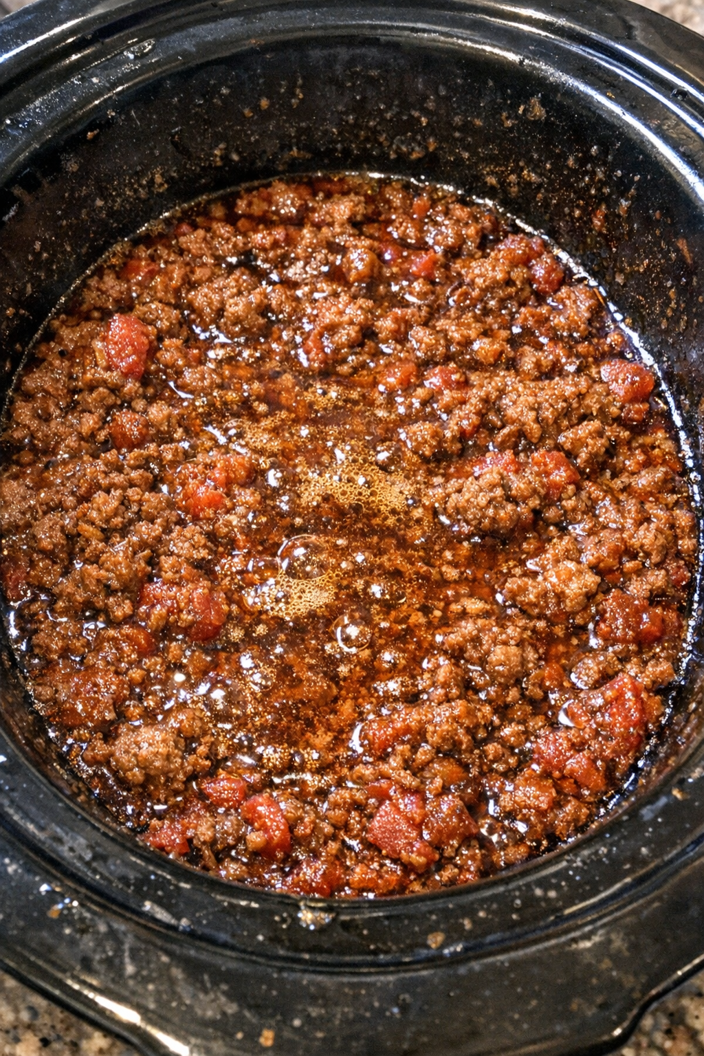 Slow cooker chorizo mixture bubbling in the pot