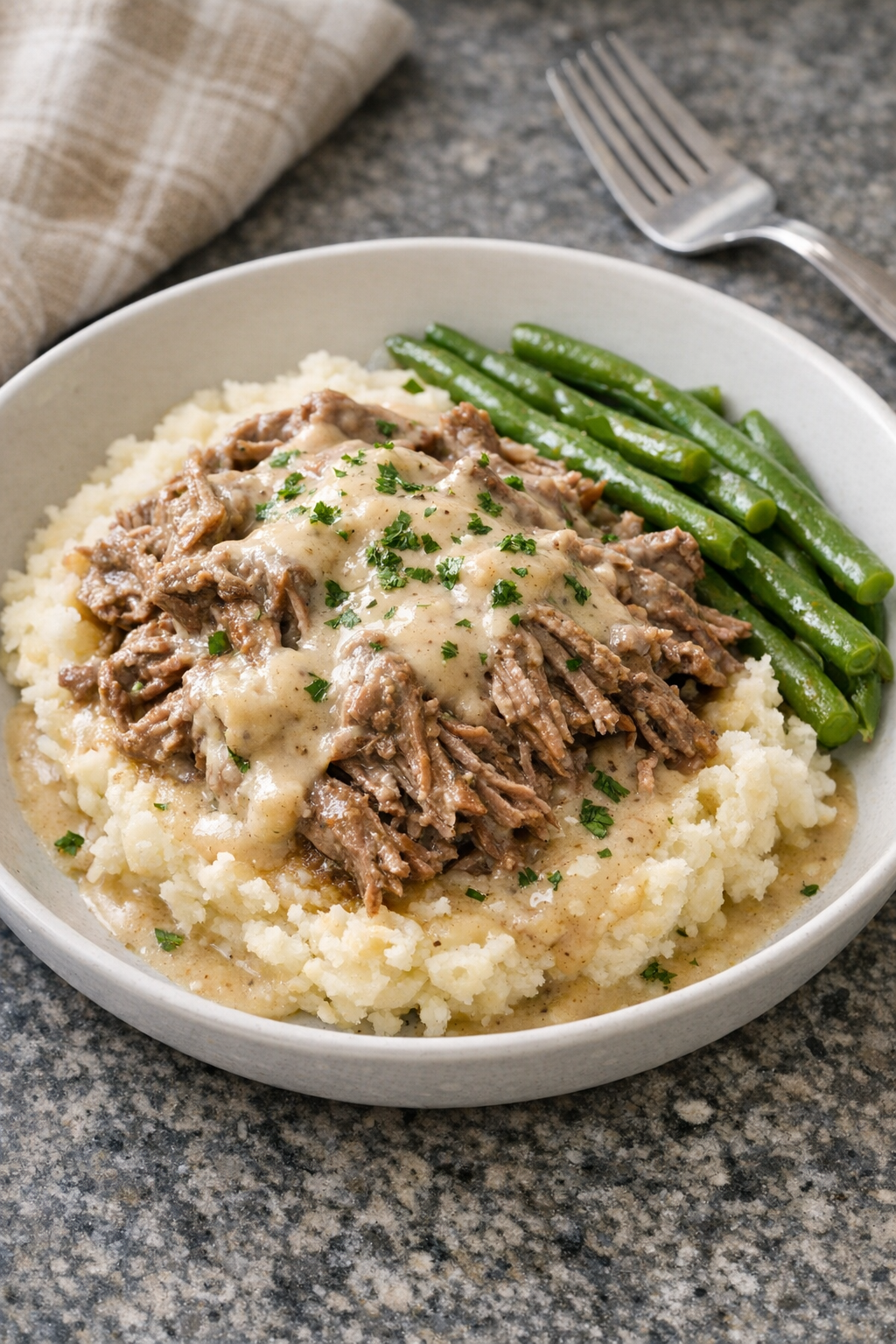 Creamy Amish sour cream beef served on mashed potatoes