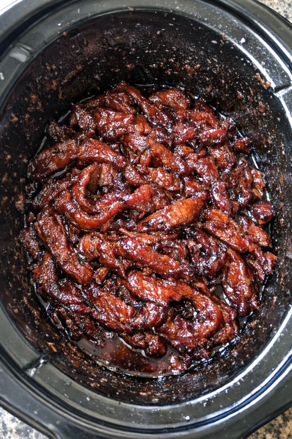 Slow cooker dish with ruby-glazed protein ribbons