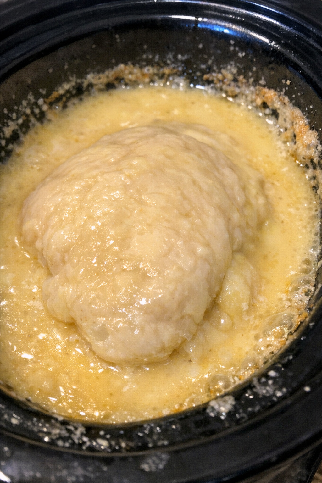 Slow cooker dish with creamy yellow sauce