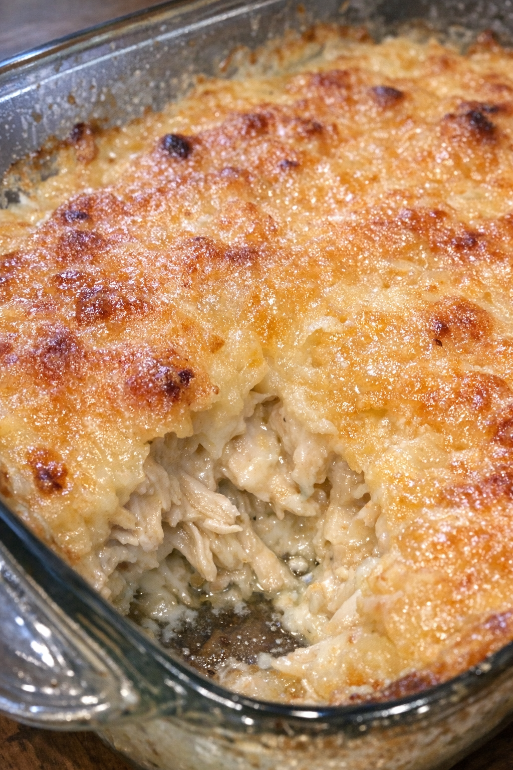 Bubbly golden casserole in a glass dish