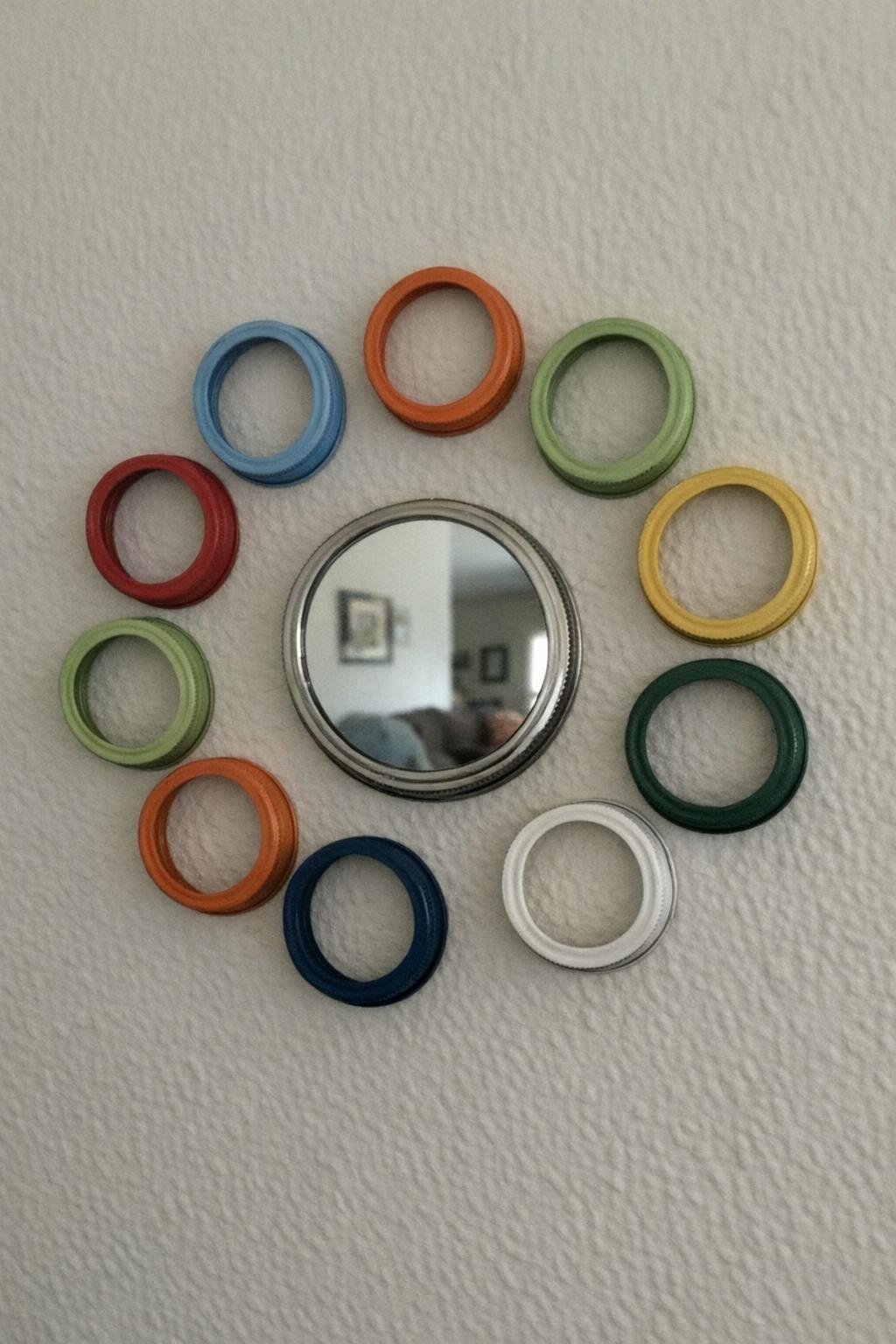 Sunburst mirror framed with painted mason jar rings