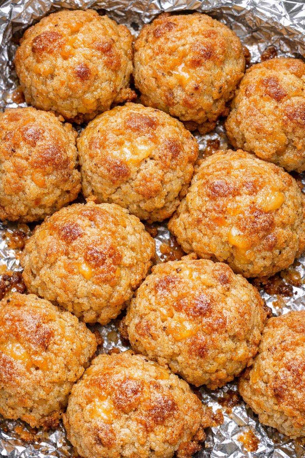Southern 3-ingredient savory cheese balls on a foil-lined baking tray