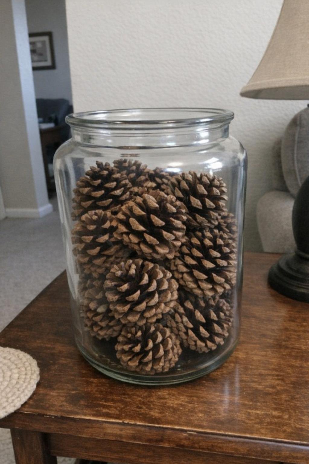 Cinnamon-scented pine cones displayed in a glass jar