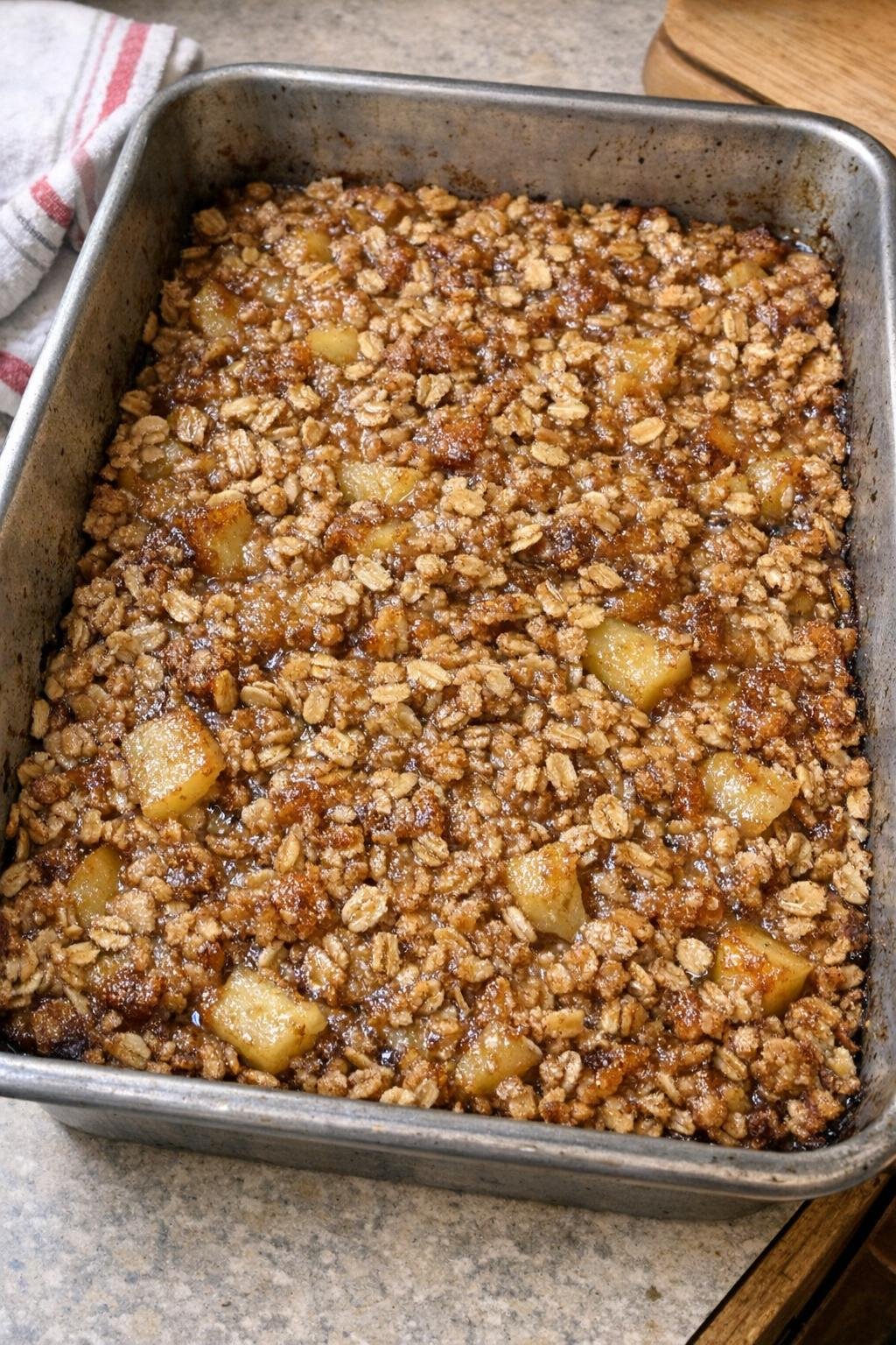 Baked apple cinnamon oat dessert in a roasting pan